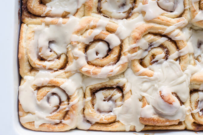 Pan of frosted eggnog cinnamon rolls