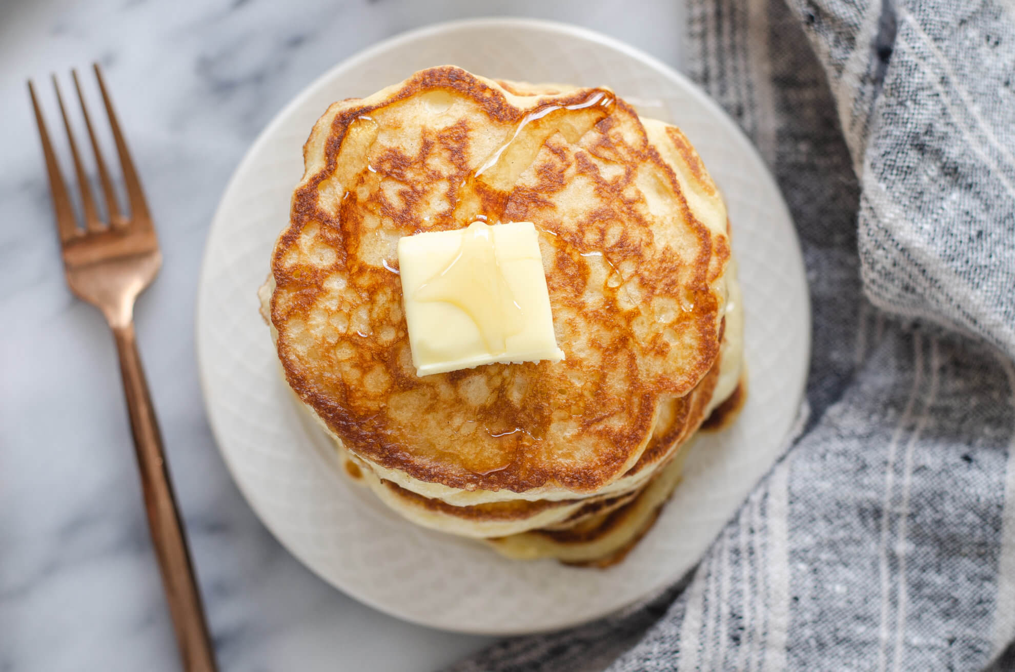 Sourdough Kefir Pancakes topped with butter