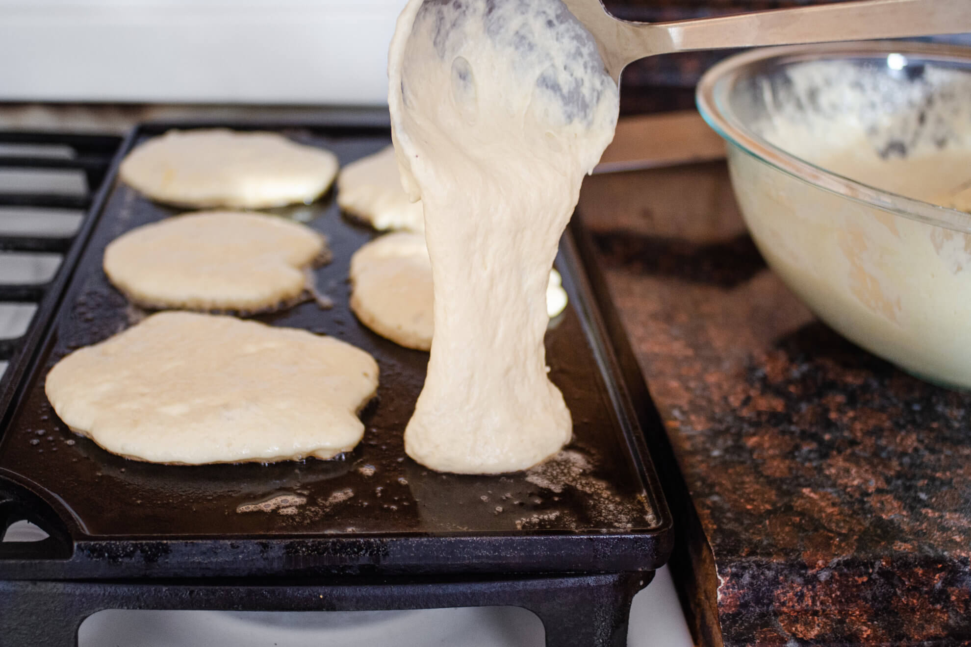 Sourdough Kefir Pancake batter poured on skillet