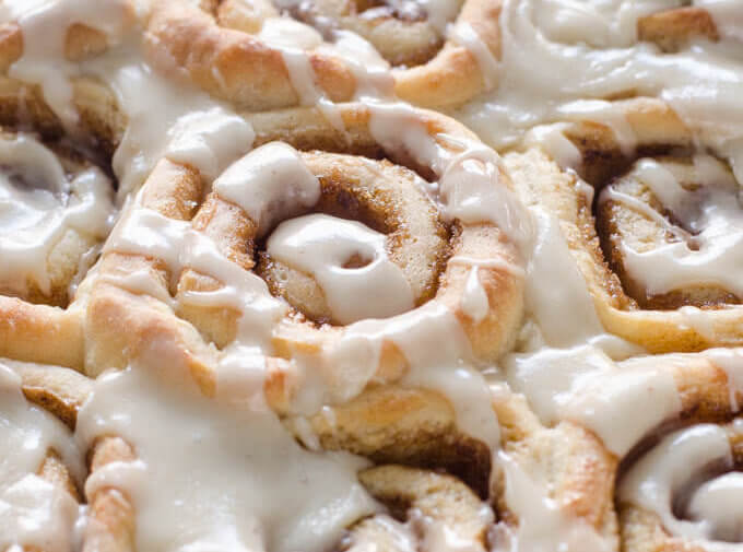 Close-up of frosted eggnog cinnamon rolls